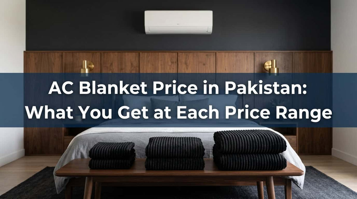 Folded black ribbed AC blankets on a bed under an air conditioner