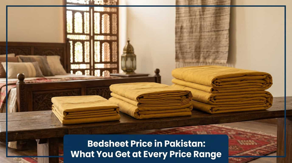 Stacks of folded mustard and camel bedsheets on a bed