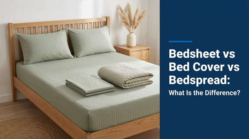 Sage green bedsheet on a bed with folded sheets at the foot