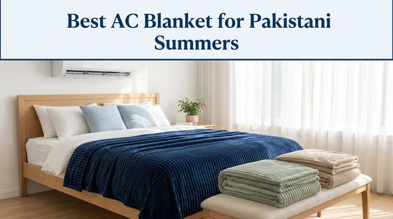 Navy blue ribbed AC blanket on a bed with folded blankets beside it