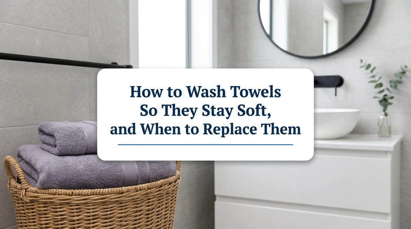 Soft grey and white towels in a laundry basket