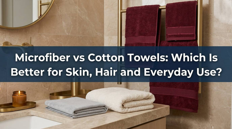 Maroon and cream cotton towels hanging and folded in a bathroom
