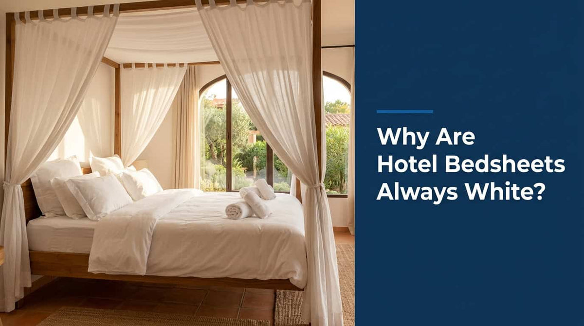 White bedsheets on a hotel-style bed beside an arched window