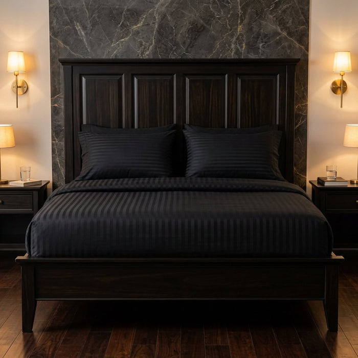 Black cotton fitted bedsheet with 2 pillow covers on a king size bed