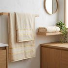 Cream cotton bath towels hanging in a bathroom, Home Living 2 piece towel set