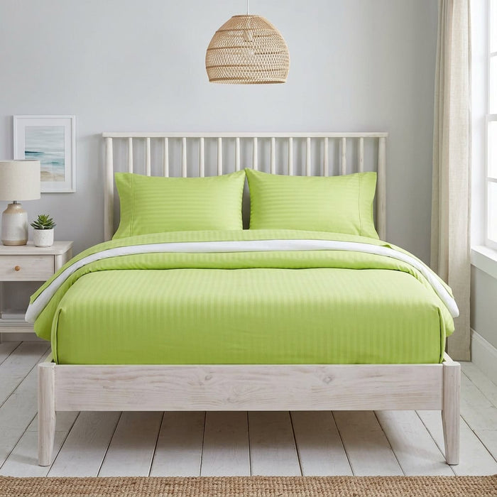 Lime green cotton fitted bedsheet with 2 pillow covers on a king size bed