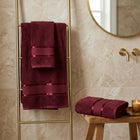 Maroon cotton bath towels hanging in a bathroom, Home Living 2 piece towel set