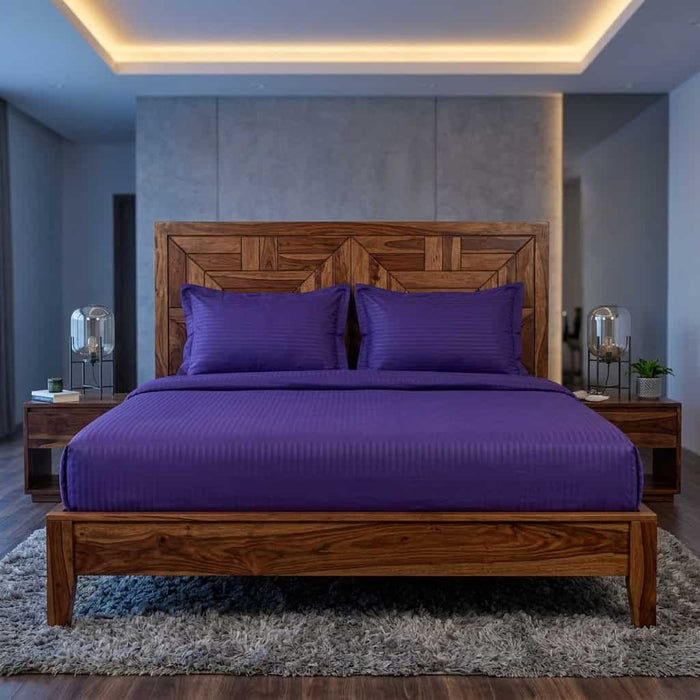 Royal purple cotton fitted bedsheet with 2 pillow covers on a king size bed