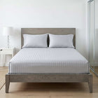 Silver grey cotton fitted bedsheet with 2 pillow covers on a king size bed