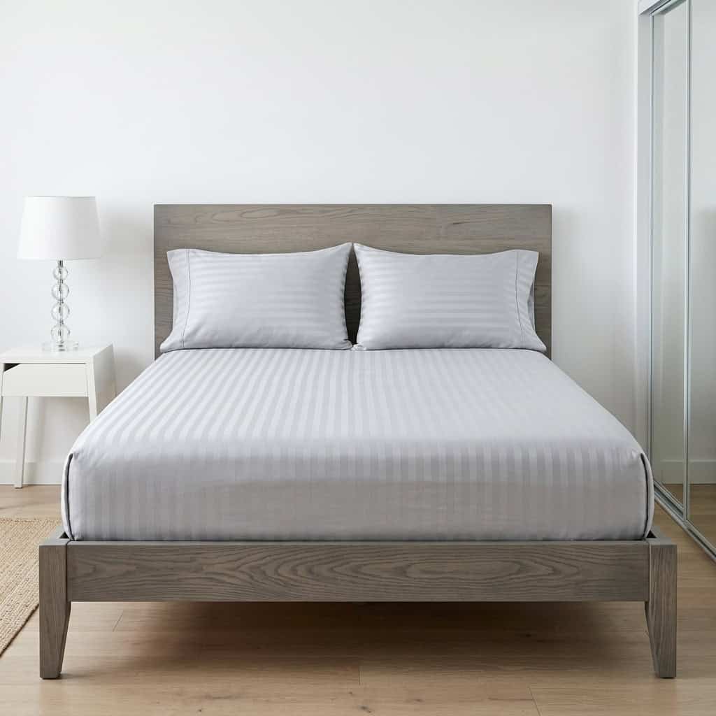 Silver grey cotton fitted bedsheet with 2 pillow covers on a king size bed
