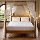 White cotton fitted bedsheet with 2 pillow covers on a king size bed